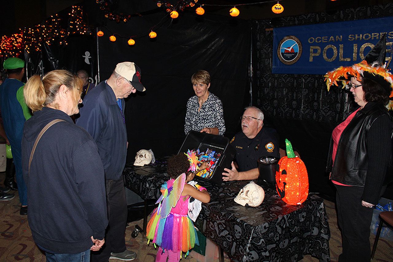 (North Coast News) Halloween in celebrated by young and old at the Ocean Shores Convention Center, where the Ocean Shores Police Department has a booth set up at the event hosted by the Ocean Shores Firefighters Association on Oct. 31.