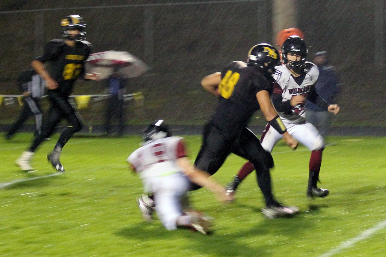 North Coast News: North Beach’s Ben Poplin heads for the end zone for one of his four touchdowns.