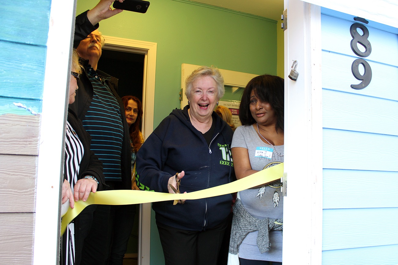 North Coast News: Ocean Shores Mayor Crystal Dingler cuts the ribbon on the new KOSW studio.