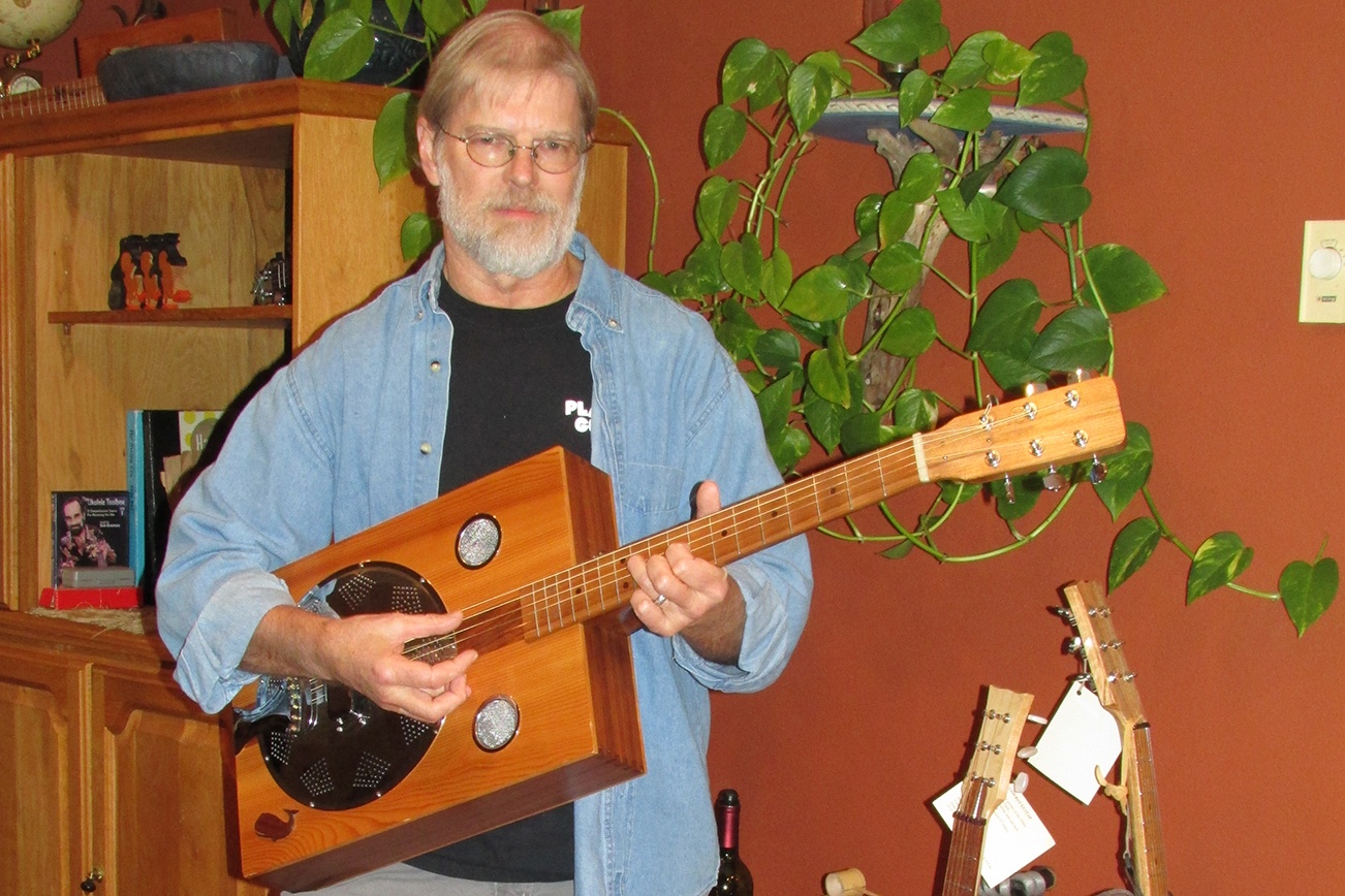 Scott D. Johnston photo: Local luthier Jerry Wolles displays one of the unique guitars he has made. His wares will be on sale this weekend for the annual Winter Fanta-Sea festival at the Ocean Shores Convention Center.