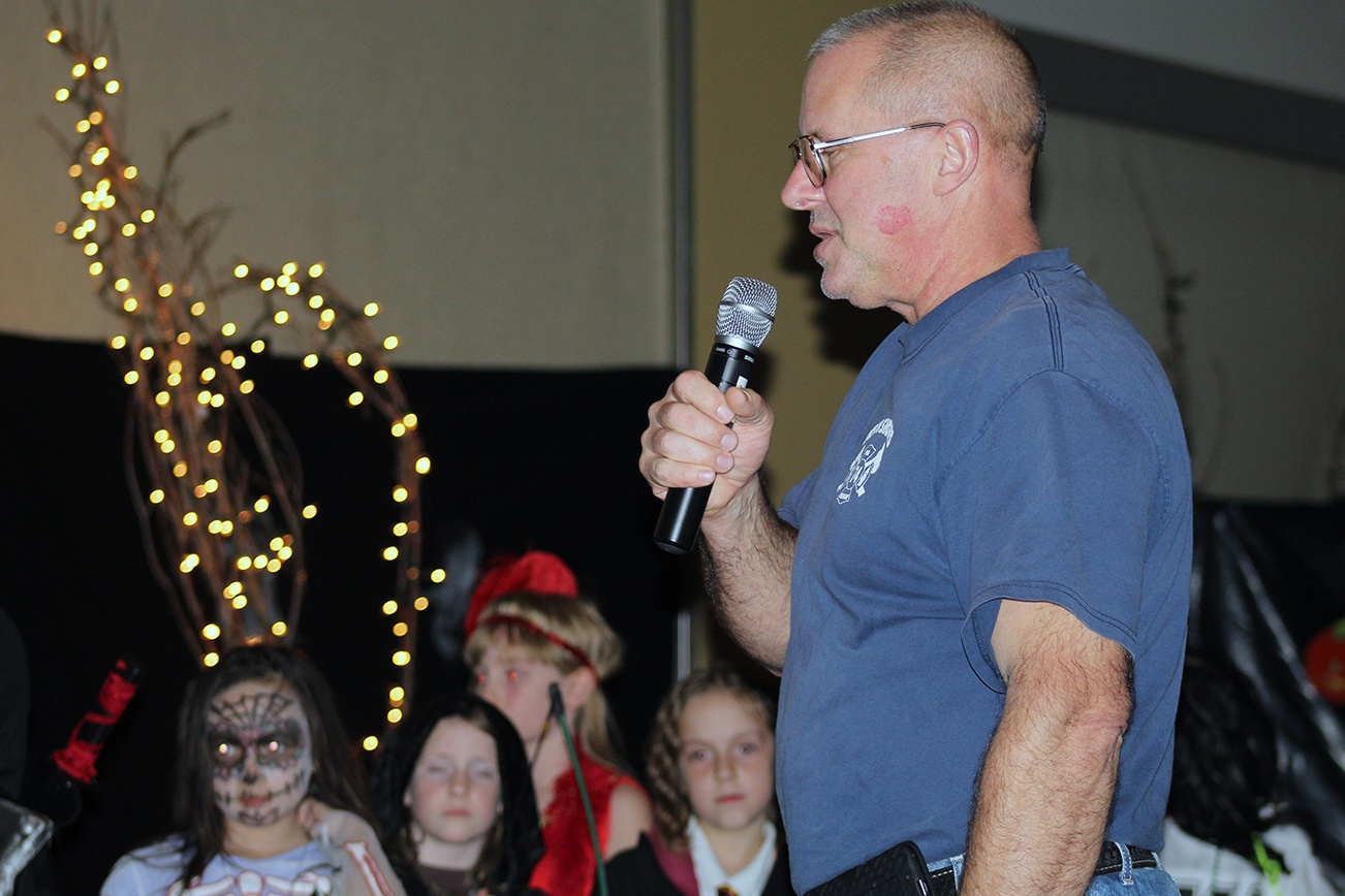 Angelo Bruscas/North Coast News: Halloween master of ceremonies Jim Davies of the Ocean Shores Firefighters Association presides over the costume contest that is a popular part of the Spooktacular event at the Ocean Shores Convention Center.