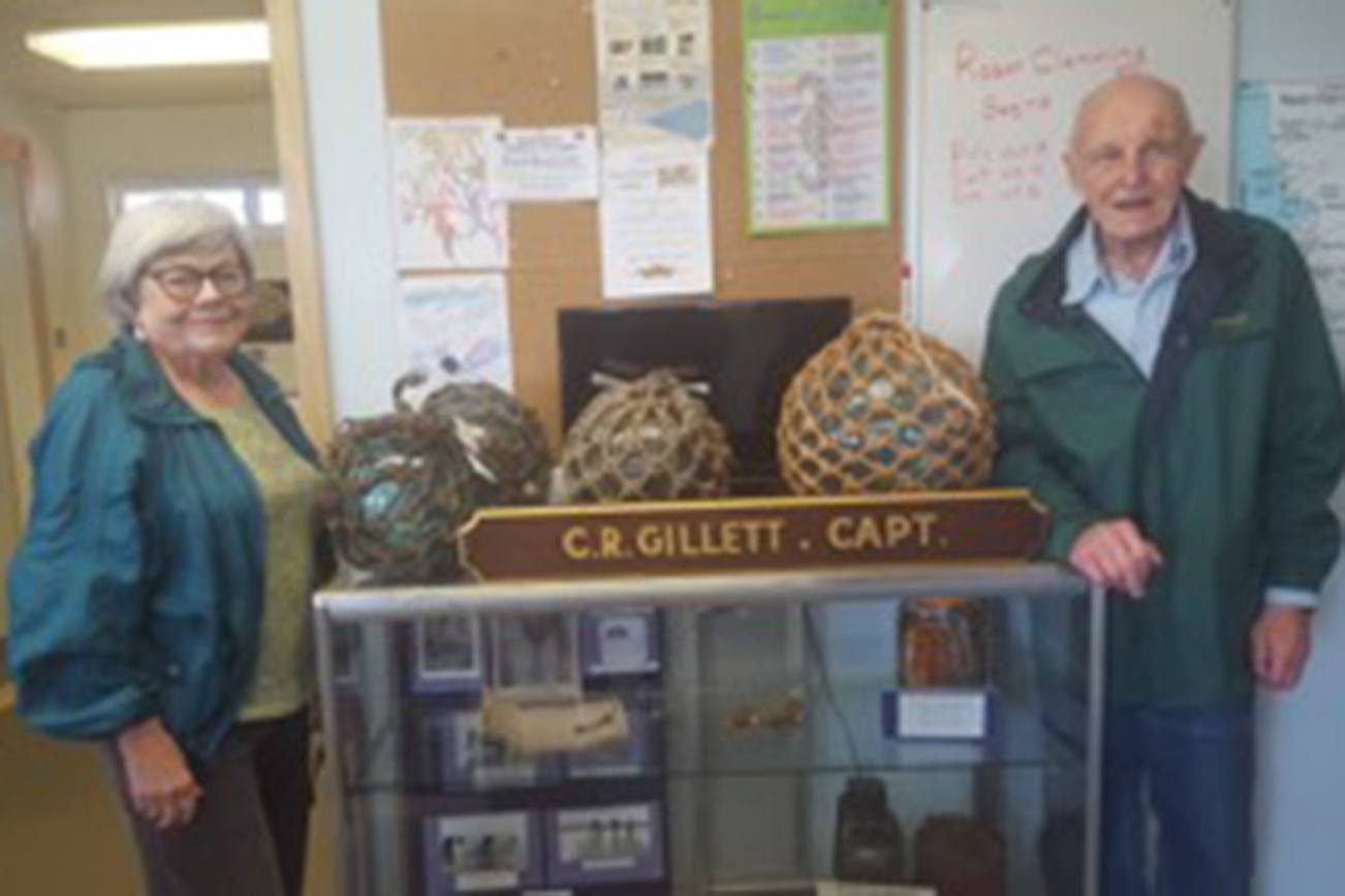 Captain (Ret.) C.R. and Mrs. Gillett show some of the glass floats donated to the Coastal Interpretive Center.
