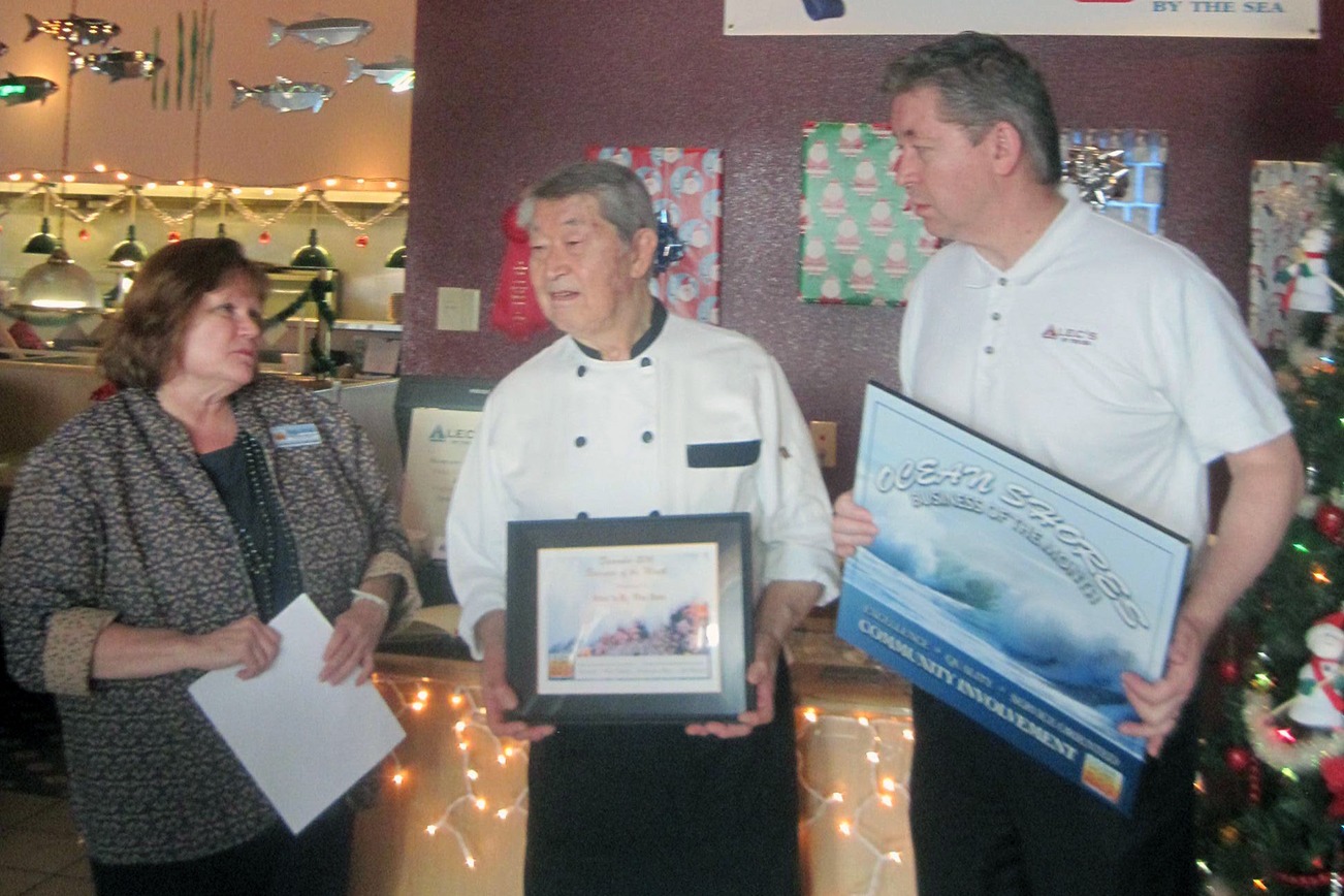 Arnold Samuels photo: Alec Takagi, center, and his family-owned and operated Alec’s by the Sea restaurant was named the Business of the Month for December by the Ocean Shores/North Beach Chamber of Commerce. Alec’s is one of Ocean Shores longstanding local favorites at 131 W Chance a La Mer NW: (360) 289-4026