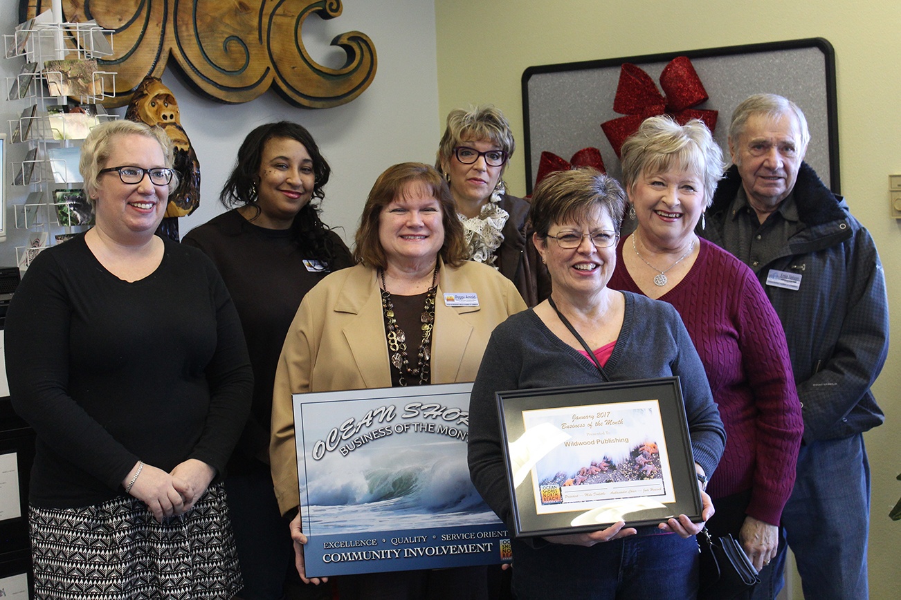 North Coast News photo: New Chamber Director Piper Leslie, far left, joins the Ocean Shore/North Beach Chamber Ambassadors in presenting the Business of the Month award to Marlene Thomasson and the Ocean Shores Observer