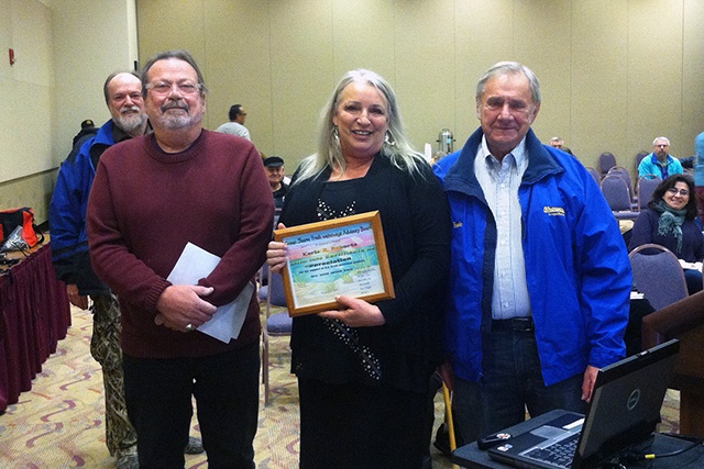 North Coast News: Retiring Ocean Shores Public Works assistant Karla Roberts, center, receives an award of appreciation from Fresh Waterways volunteers Bruce Malloy, left, and Ernie Nelson.