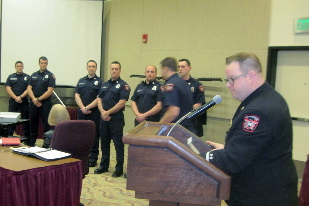 Arnold Samuels photo: Interim Fire Chief Brian Ritter addresses the new firefighters who all completed their first year under a federal grant program.
