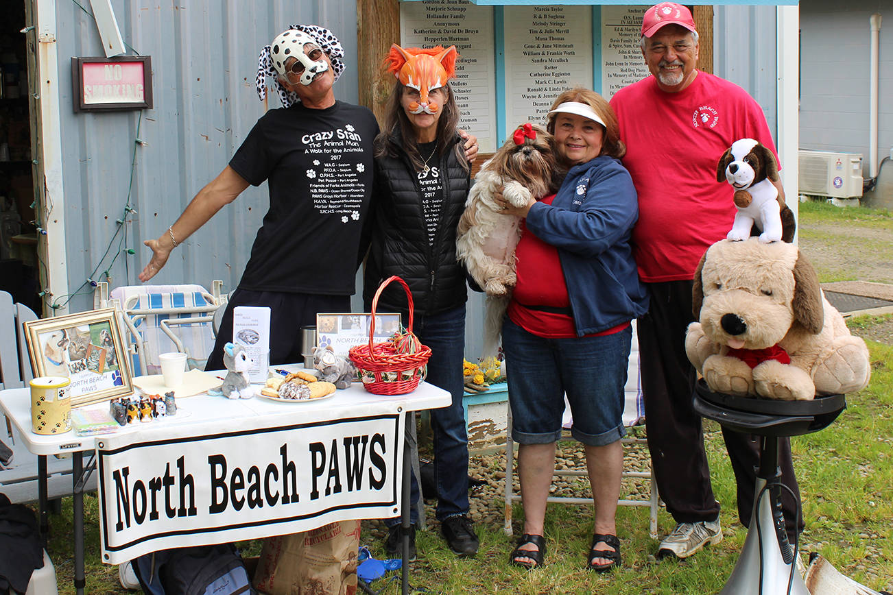 North Coast News photo: Stan the Animal Man and Beautiful Sal (Bob and Nancy Fay) with Lorna and Mike Valdez of North Beach PAWS at the PAWS Saturday grarage sale.