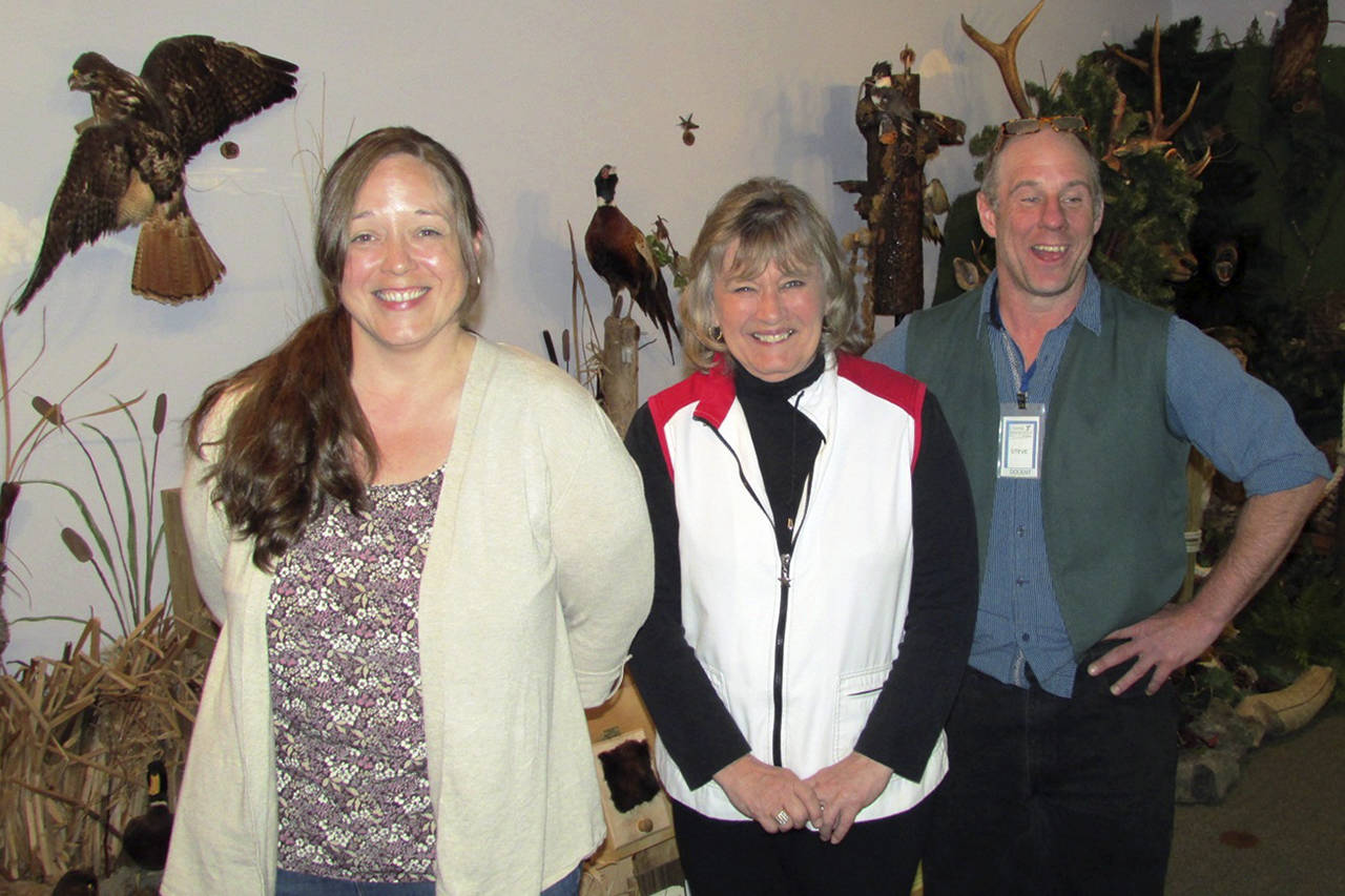 Beth Hunkins, left, is the new executive director of the Coastal Interpretive Center in Ocean Shores. With her are outgoing director Darlene Roselle and lead docent Steve Green. (Photo by Scott D. Johnston)