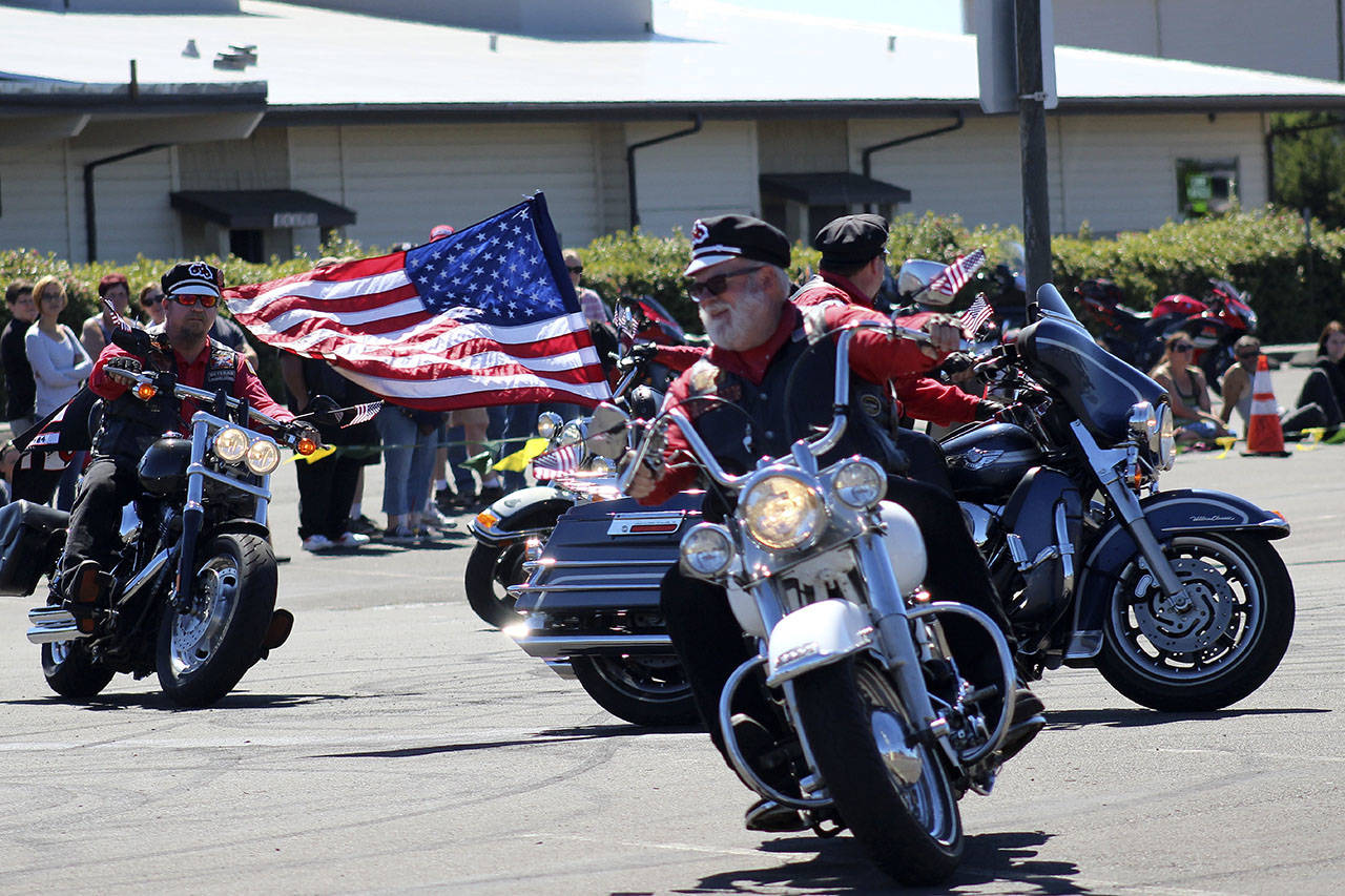Angelo Bruscas/North Coast News: The Tenino Motorcycle Drill Team from Lacey is led by Team Capt. Jesse Lamp. Started in 1983, the team is one of the most popular returning features of Bikers at the Beach at the Ocean Shores Convention Center.