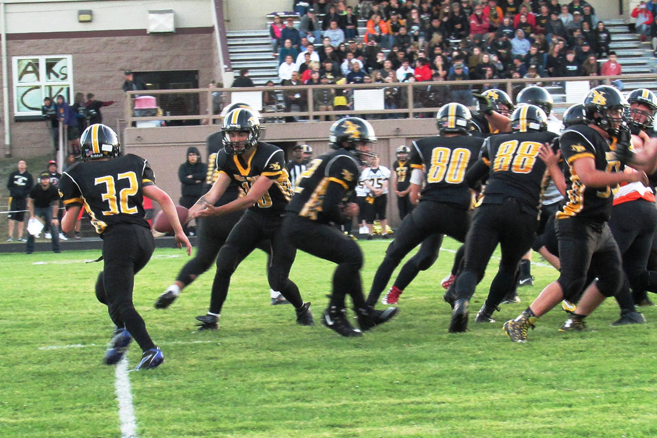 Scott Johnston photo: The Hyaks run their offense in the first half of the home opener Friday night against Rainier.