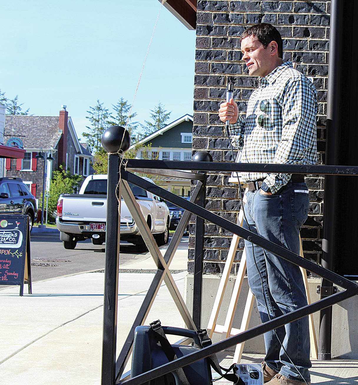 Angelo Bruscas | The North Coast News Casey Roloff addresses a crowd outside the new retail business district that is sprouting up at Seabrook.