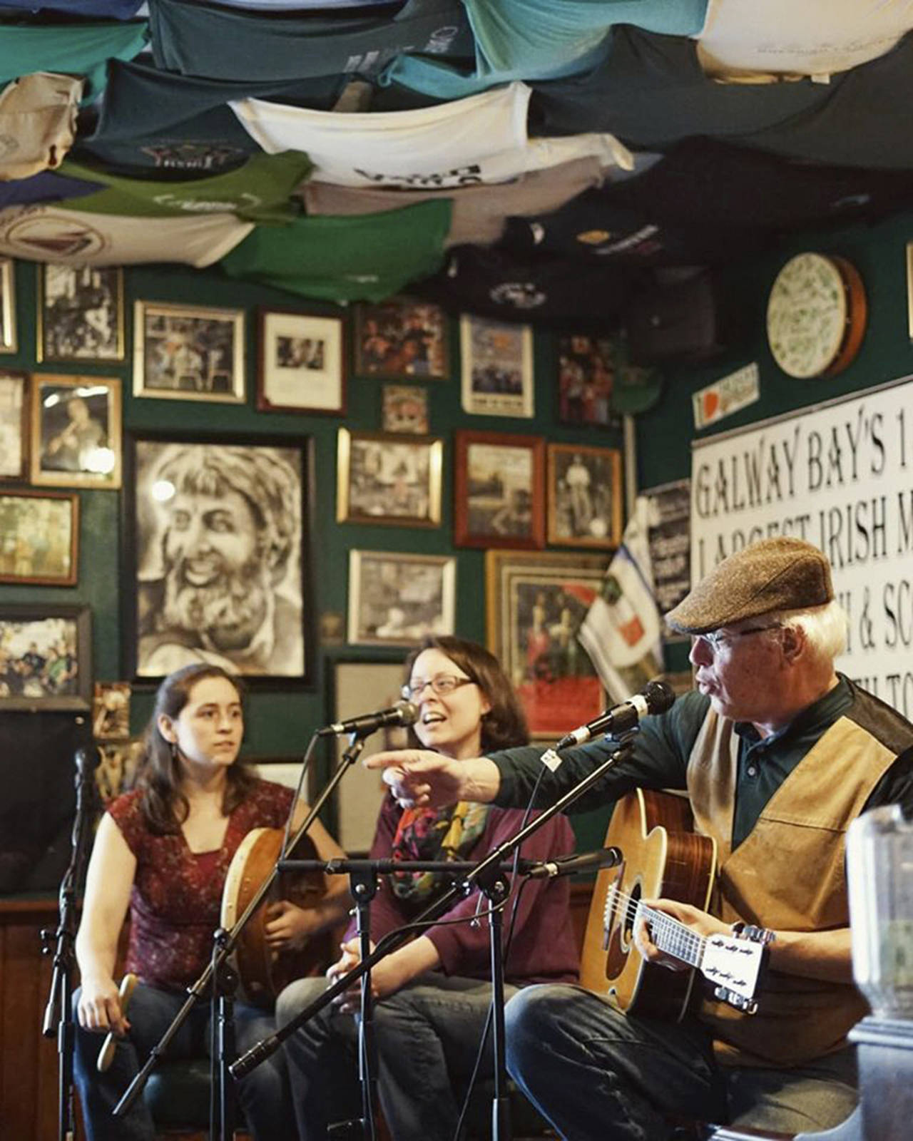 (Courtesy photo) Hank Cramer performs at Galway Bay recently with two sisters from Chehalis: Maggie MacInnis and Jessie Erickson.