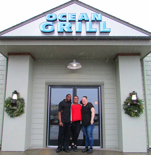 Danica Thomas, Michael Atkins, and their daughter, Melia Atkins, at the Ocean Grill, the restaurant that they own as of January 2nd. Photos by Scott D. Johnston