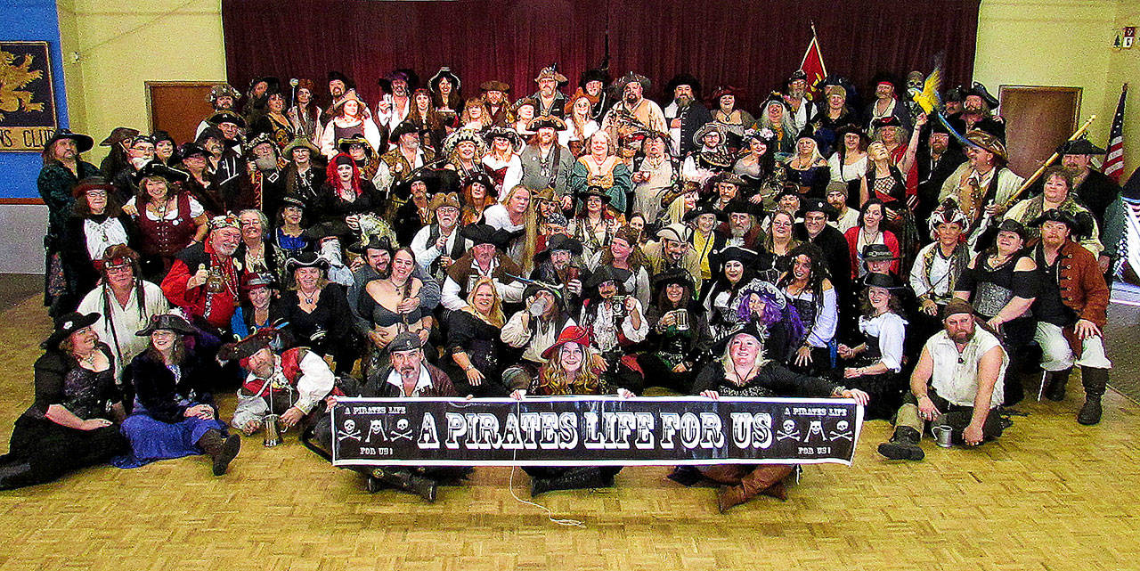 Scott D, Johnston photo: Scores of Pirates gather for the Pirates Life for Us annual gathering in the Ocean Shores Lions Club for their annual photo.