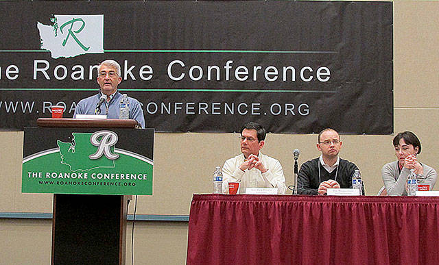 North Coast News photo from a past Roanoke Conference panel discussion at the Ocean Shores Convention Center.