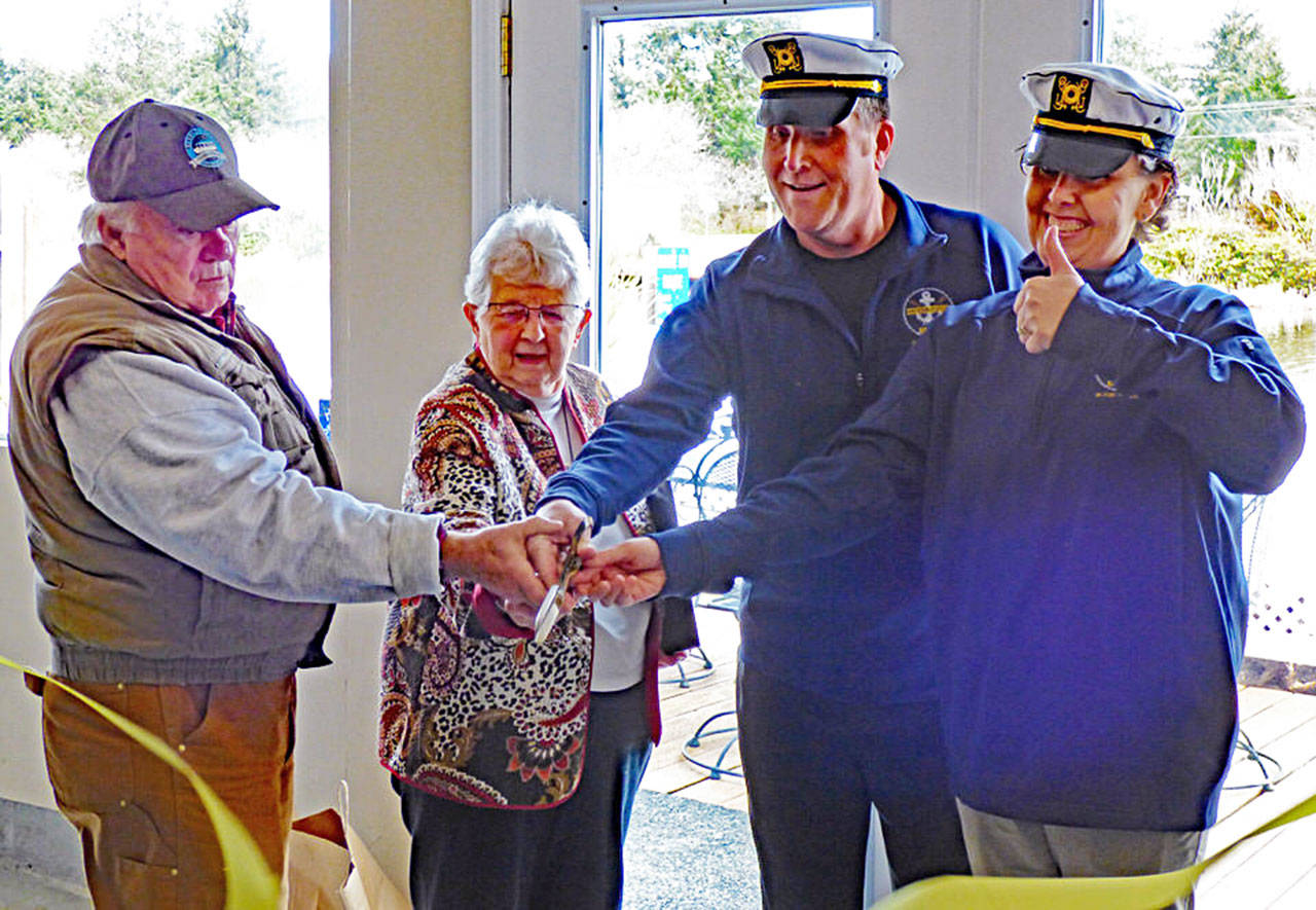 Kathy Klee Photo of the change in ownership at the Ocean Shores Boat House: (L-R) Tom and Nancy Kimzey, and Steve and Maria Borba.