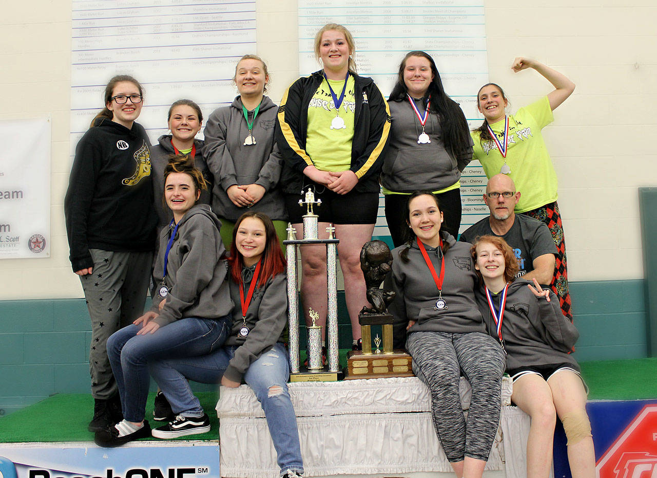 Photo by Coriann Eang                                The North Beach girls powerlifting team with coach Ric Dycus, far middle right, celebrate a third state title and two individual crowns at the State Championships in Lacey on Saturday