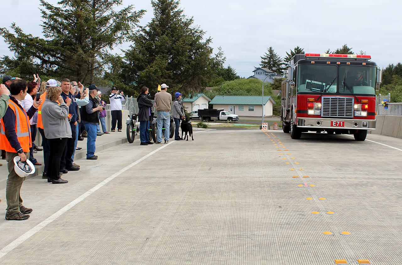 An Ocean Shores Fire engine was the first vehicle to make the trip over the new Razor Clam Bridge.