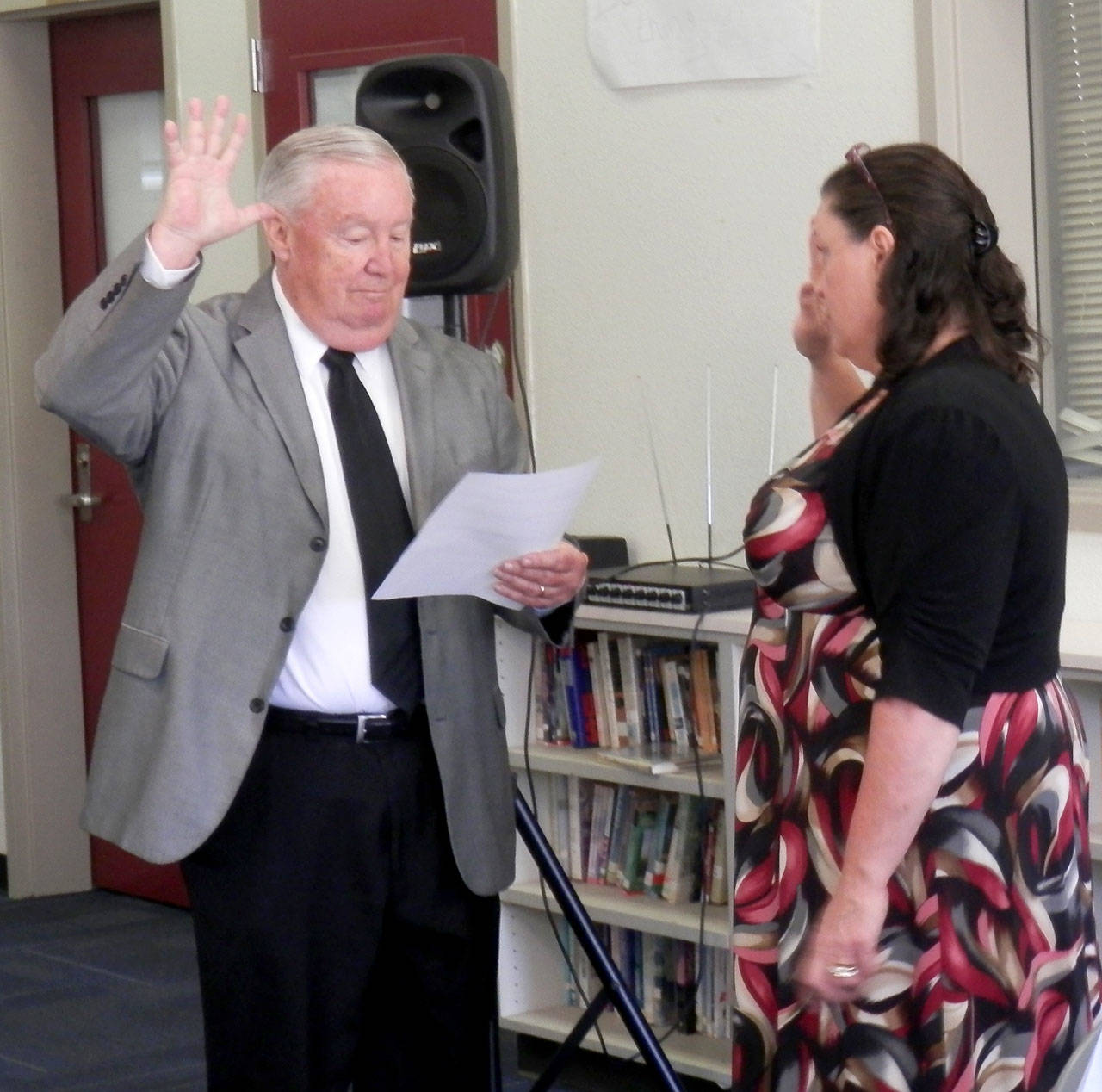 North Coast News Interim North Beach Co-superintendent Stan Pinnick administers the oath of office to new Board member Jane Harnagy.