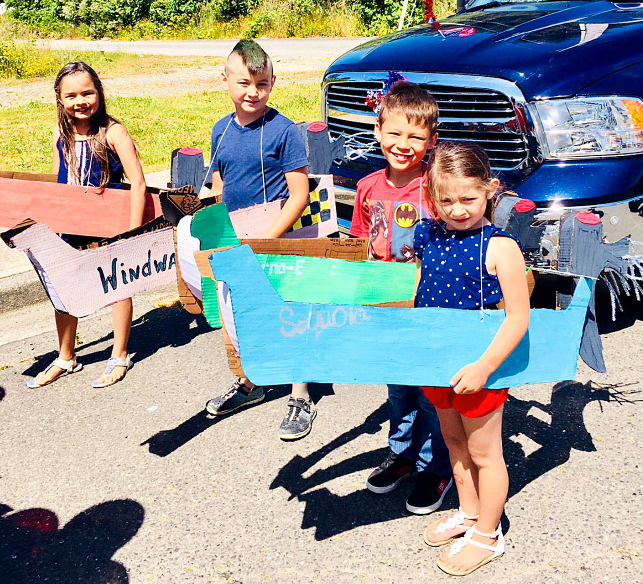 Raven Bryson photo: Kids have their own foot-powered canoes for the parade during Chief Taholah days.