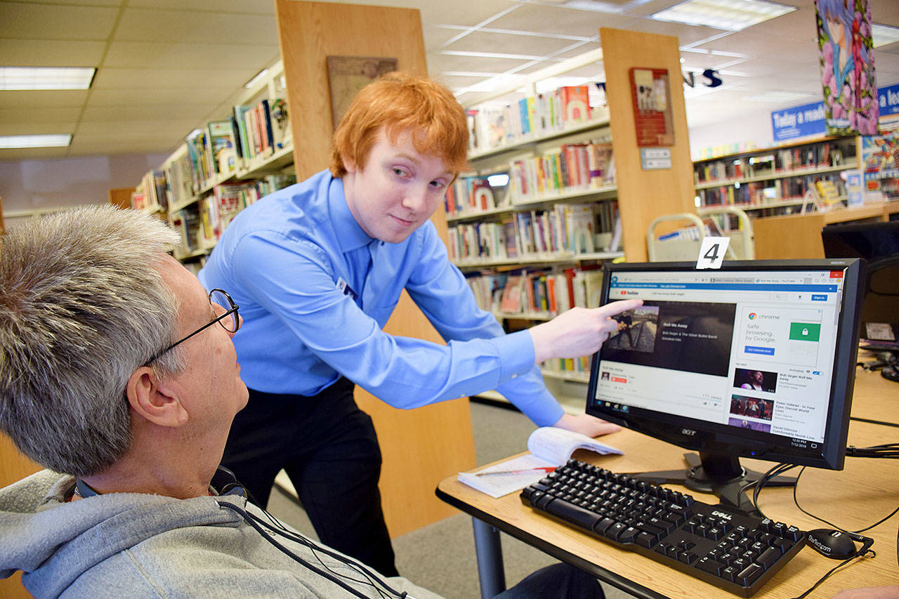 The library’s “Techie” is 23-year-old Nick Bishop, a 2013 graduate of Elma High School. Scott D. Johnston photo.