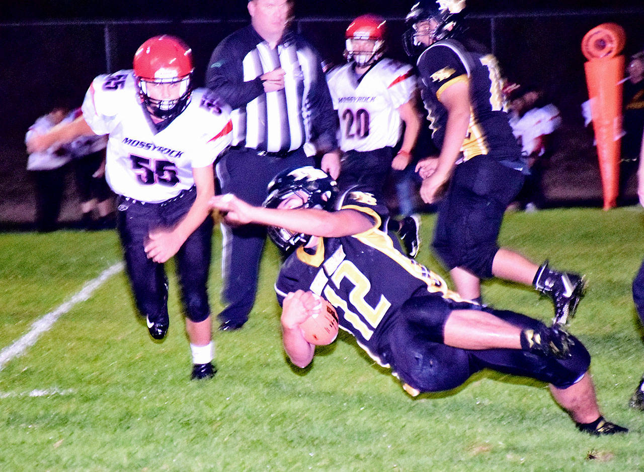 Scott D. Johnston photo: North Beach Senior Marcus Pope lunges for a first down against Mossyrock Friday Sept. 14, 2018