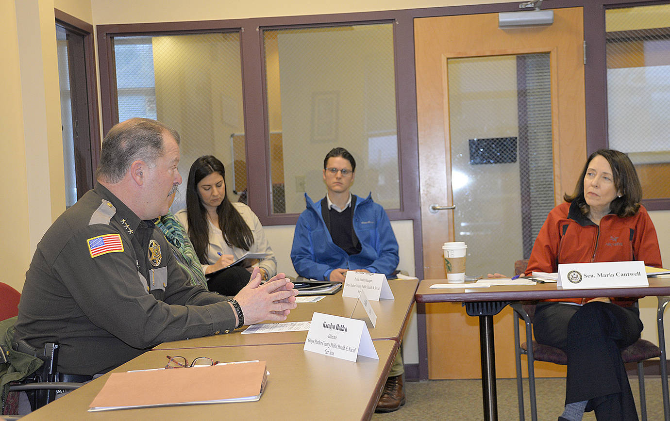 DAN HAMMOCK | GRAYS HARBOR NEWS GROUP                                Sen. Maria Cantwell, at right, talks to Grays Harbor County Sheriff Rick Scott at a panel discussion about opioid addiction in Aberdeen Monday morning. Scott explained his jail is filled to capacity and 90 percent of the inmates suffer from some kind of addiction.