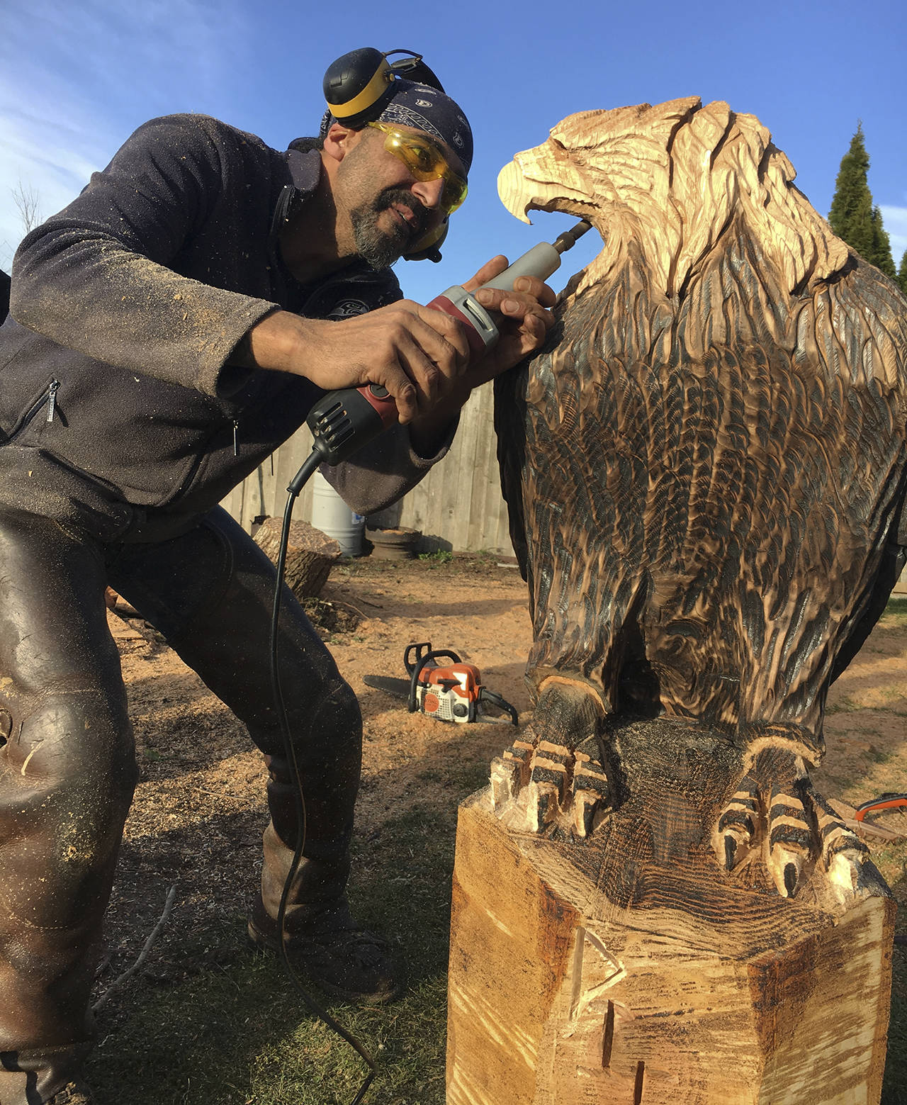 KAT BRYANT | GRAYS HARBOR NEWS GROUP                                Tony Robinson, who operates Native Beach Accessories in Copalis Crossing, helped organize the charitable event in Port Orchard. He created this eagle for Ron Pierce, one of the homeowners affected by the tornado.