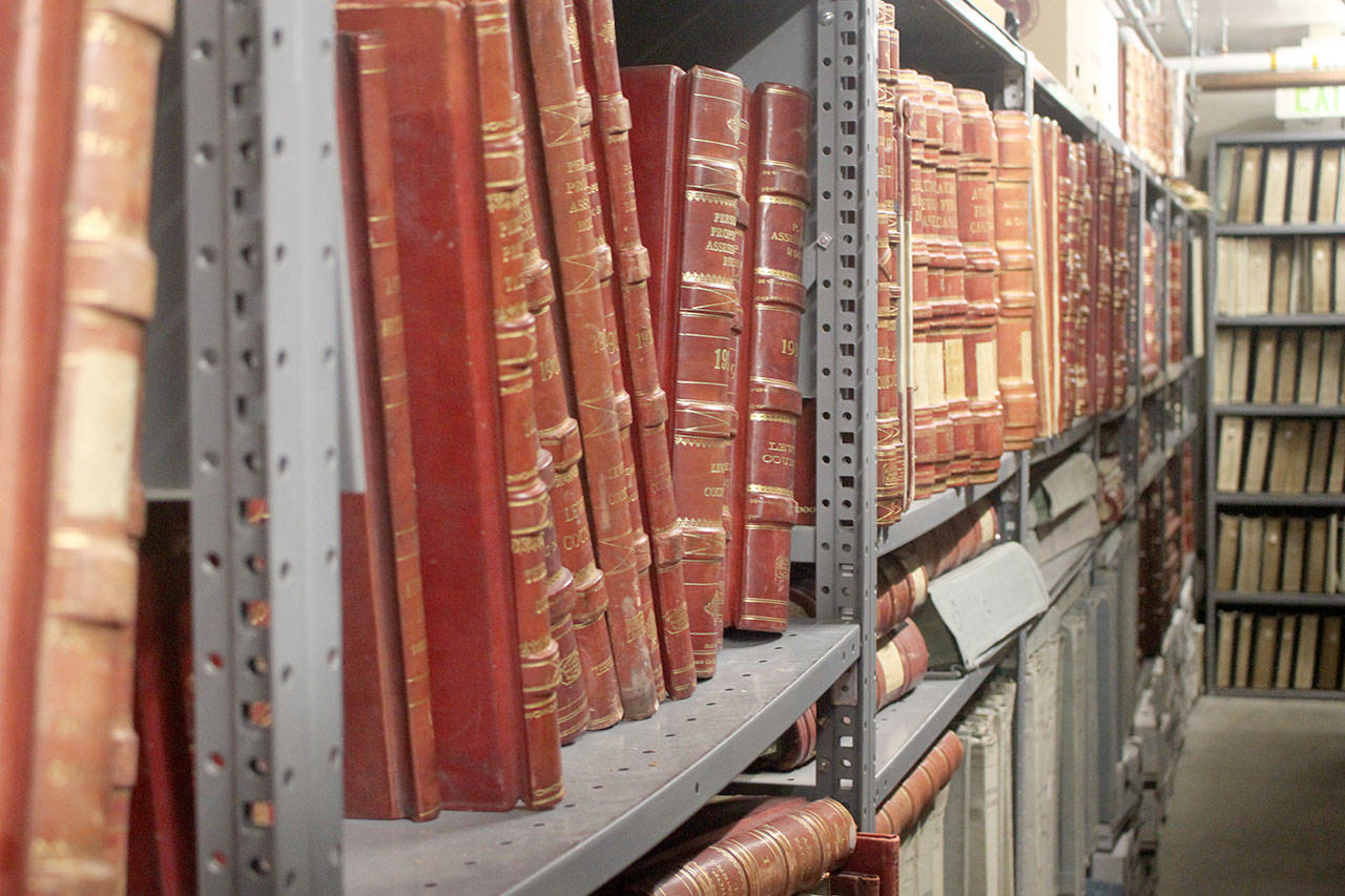 Bound volumes are county records stored in the Washington State Archives building. Records have been damaged by water, but none were completely lost in the incidents. – Photo by Emma Scher, Washington Newspaper Publishers Association