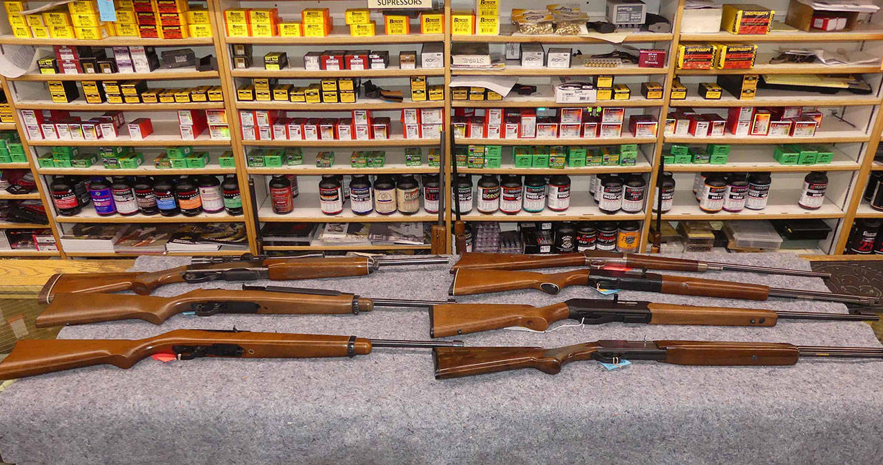 These firearms at Clark’s All-Sports in Colville qualify as assault rifles under the law. – Photo courtesy of Statesman-Examiner