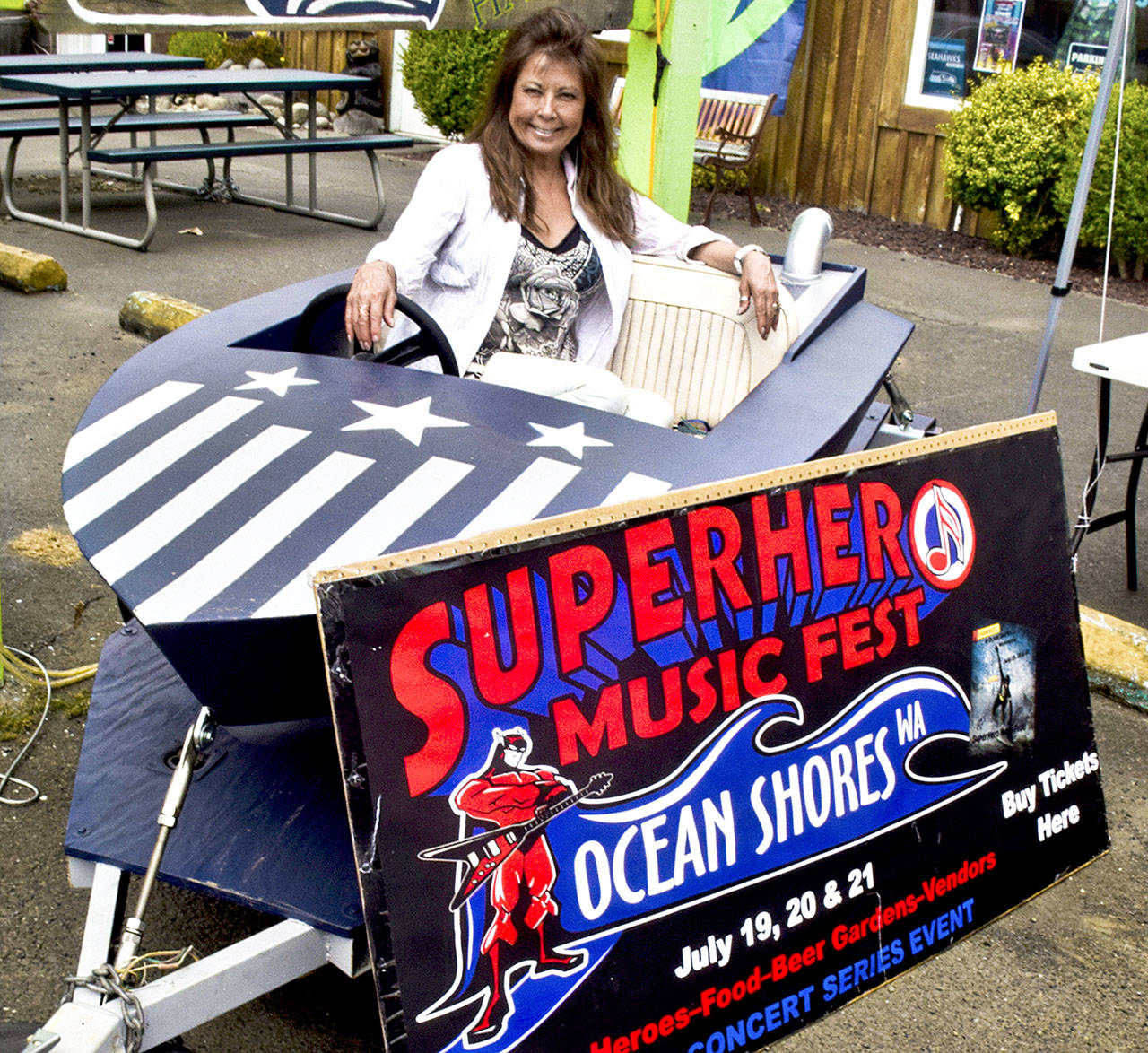 Ocean Shores business owner and rookie concert promoter June Bongirno prepares for the Superhero Music Fest to be held Friday through Sunday at the Ocean Shores Convention Center. (Photo by Scott D. Johnston)