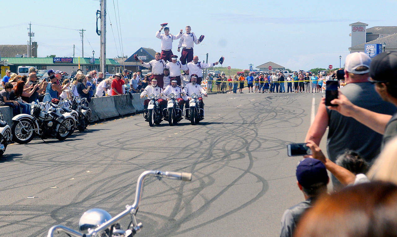The Cossacks Motorcycle Stunt Team forms a human pyramid during its show at Hog Wild in Ocean Shores on Saturday. (Photo by Hasani Grayson | Grays Harbor News Group)