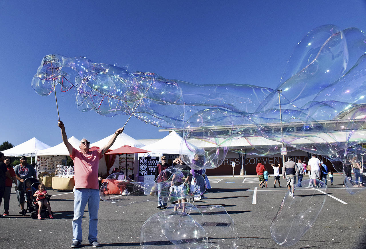 Photos by Scott D. Johnston | For Grays Harbor News Group                                Ed Schroll of Ocean Shores delighted patrons with his bubble art during last year’s AAOS Arts Crafts Festival.