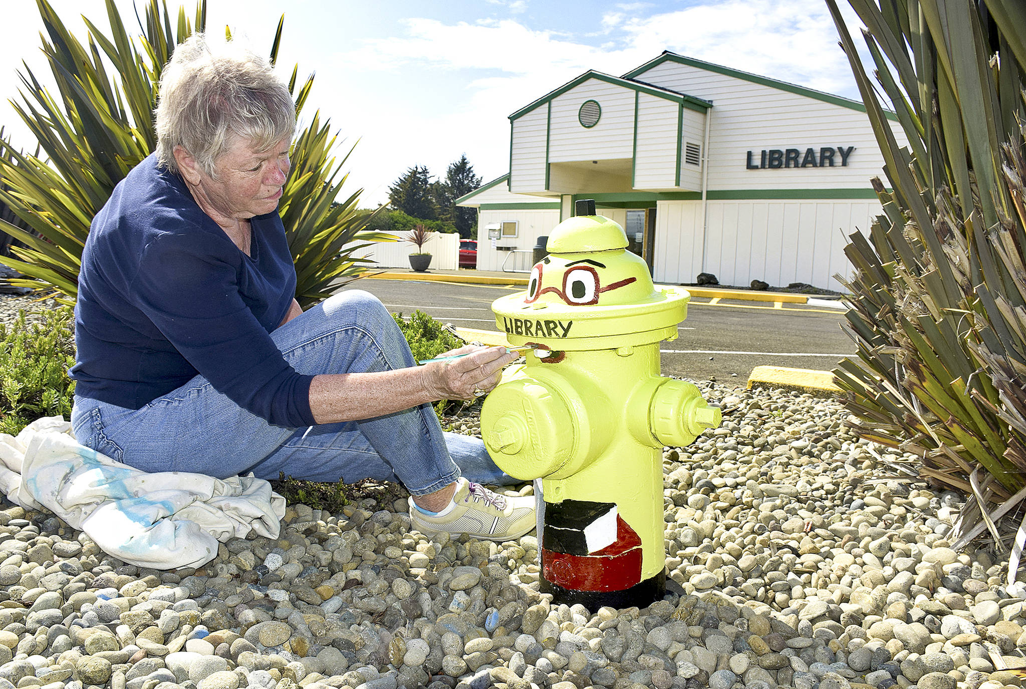 Photo by Scott D. Johnston                                Ocean Shores artist Susan LaMadrid transforms a fire hydrant in front of the Ocean Shores Library into a bookworm, in anticipation of the library’s reopening early next month. The library has been closed since July for an expansion project that has been funded entirely by donations. Meanwhile, the Ocean Shores Fire Department continues its “Adopt a Hydrant” plug painting project, in which anyone can participate by stopping by the Fire Station, next door to the library, for information and applications.                                Ocean Shores artist Susan LaMadrid transforms a fire hydrant in front of the Ocean Shores Library into a bookworm, in anticipation of the library’s reopening early next month. The facility on Pt. Brown Ave. NE has been closed since July for an expansion project that has been funded entirely by donations. Meanwhile, the Ocean Shores Fire Department continues its “Adopt a Hydrant” plug painting project, in which anyone can participate by stopping by the Fire Station, next door to the library, for information and applications. (Photo by Scott D. Johnston)