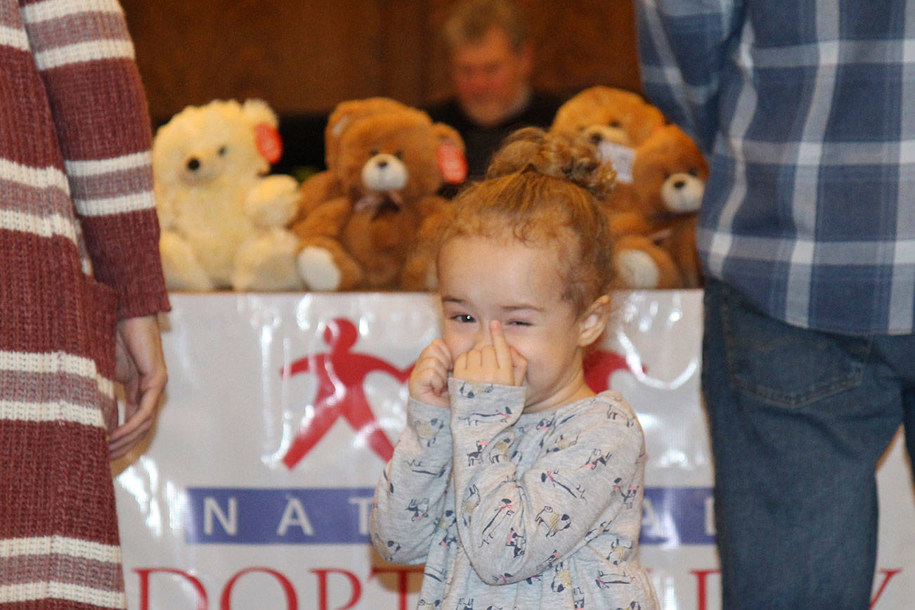 Sawyer Drake tries to contain her excitement about getting a new cousin Friday during the National Adoption Day ceremony in Judge Stephen Brown’s courtroom at Grays Harbor County Superior Court in Montesano. (Michael Lang | Grays Harbor News Group)