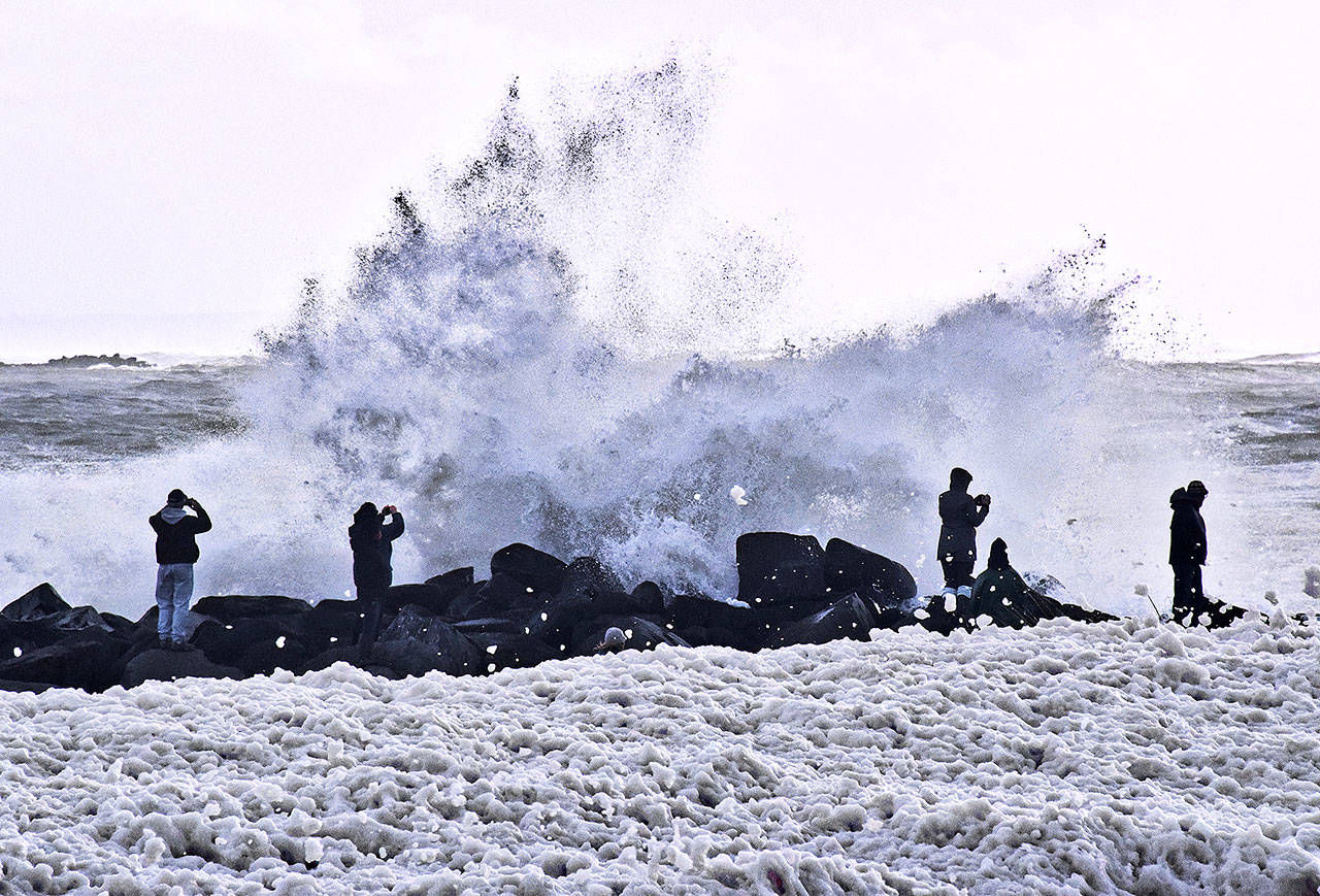 Many people turned out to photograph the sea foam that was forming in Ocean Shores. (Photo by Scott D. Johnston)