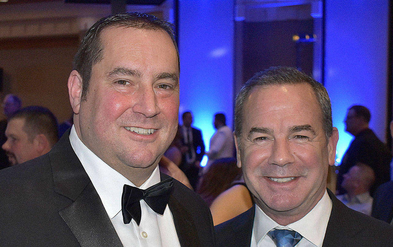 Rich Hartman of Five Star Dealerships, left, is a founding sponsor of the United Way Black and White Gala fundraiser. Paul Silvi, KING 5 sports anchor and the voice of Five Star’s radio ads, attends the fundraiser annually.
