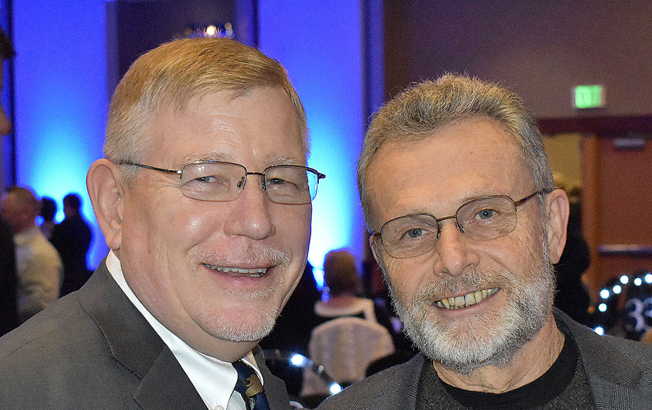 DAN HAMMOCK | GRAYS HARBOR NEWS GROUP                                Grays Harbor County Commissioner Randy Ross, left, and Grays Harbor College President Dr. Jim Minkler catch up prior to the United Way of Grays Harbor Black and White Gala at the Quinault Beach Resort and Casino Saturday.