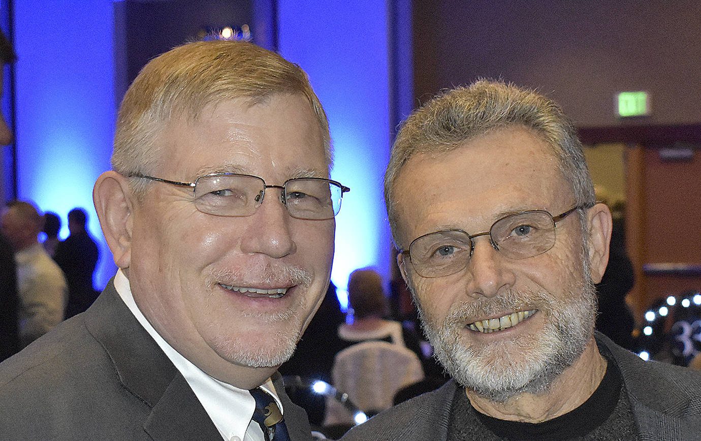 DAN HAMMOCK | GRAYS HARBOR NEWS GROUP                                Grays Harbor County Commissioner Randy Ross, left, and Grays Harbor College President Dr. Jim Minkler catch up prior to the United Way of Grays Harbor Black and White Gala at the Quinault Beach Resort and Casino Saturday.