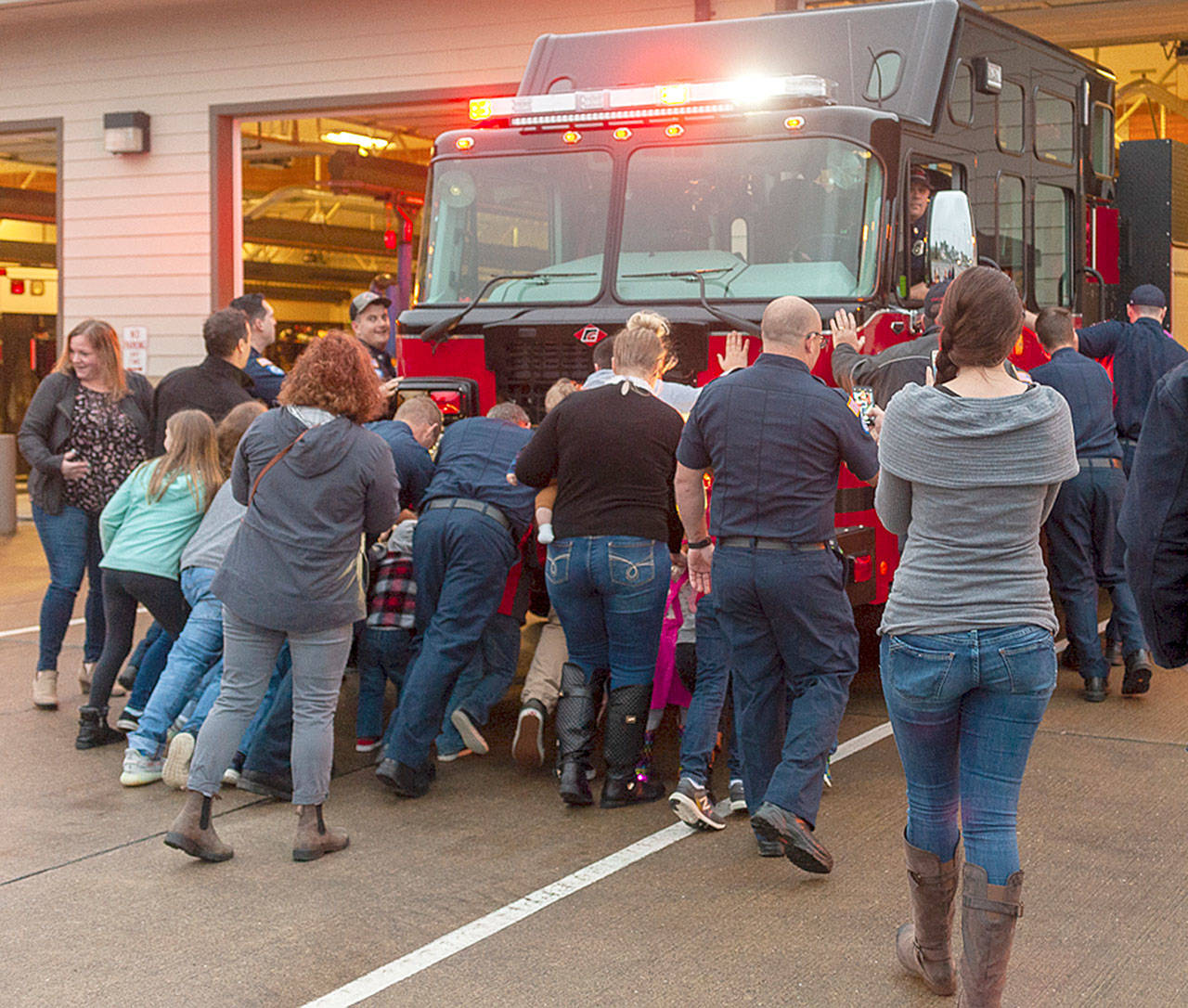 Members and friends of the Ocean Shores Fire Department dedicate the new, custom-built fire engine in a traditional push-in ceremony on Saturday, Jan. 18. (Photo courtesy of OSFD/Mike McGregor)