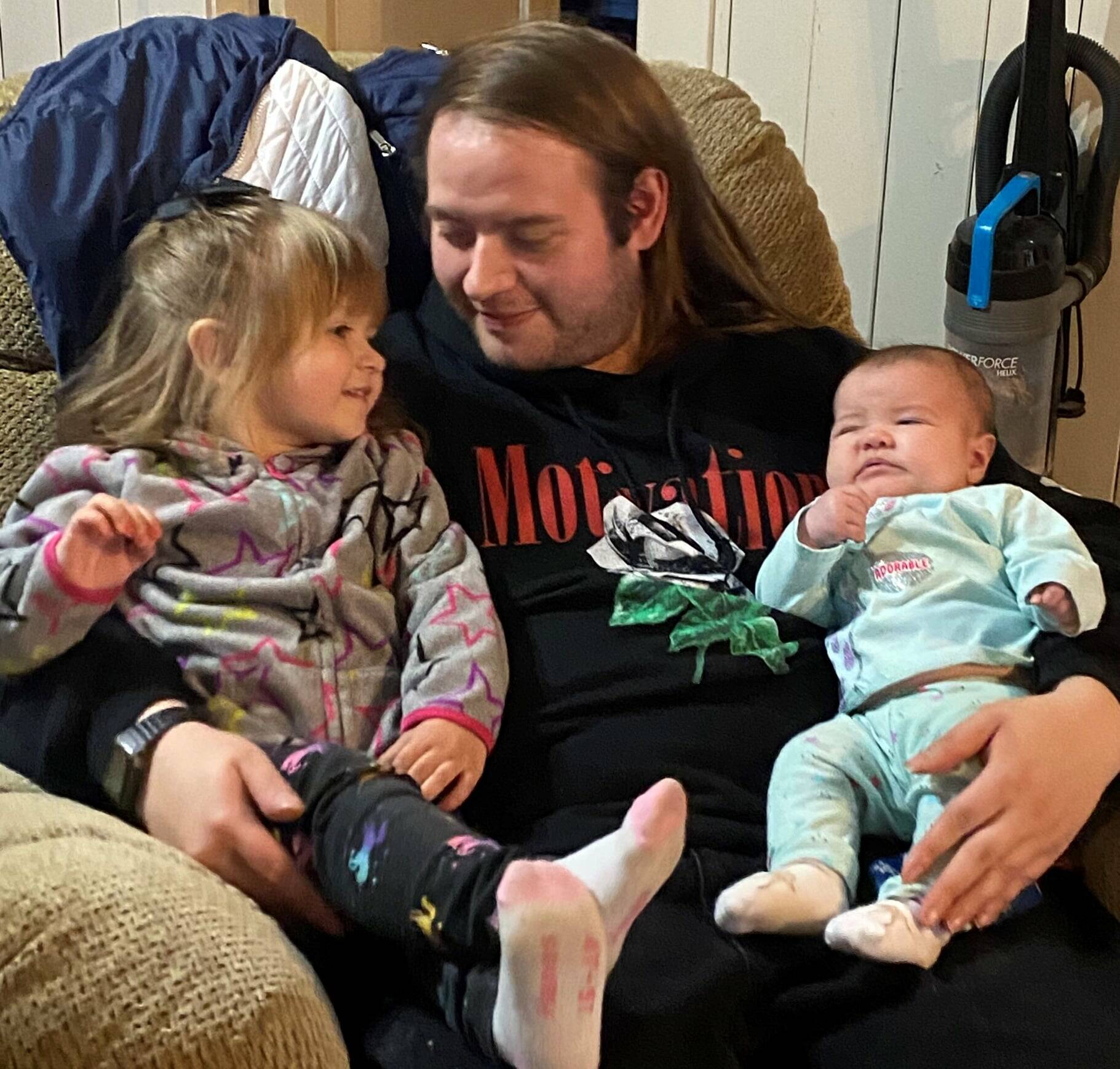 Armando Carlos Reyes, the man who was killed Monday Feb. 28, at Oceanside Motel, in Hoquiam, seen in an undated photo with his two young children. (Provided photo)