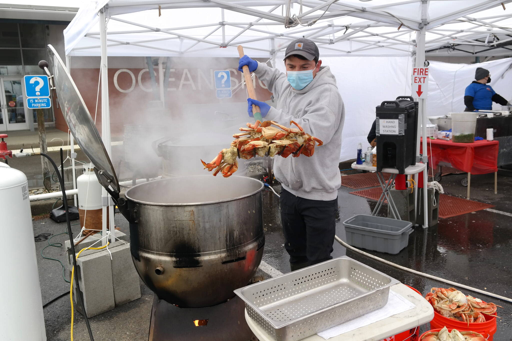 Josh Debruler of Dungeness Crab and Seafood Festival prepares a sold-out crab dinner on Sunday, March 20. This was the first year the Port Angeles-based team paired up with the Razor Clam Festival to expand seafood offerings at the annual event in Ocean Shores. Erika Gebhardt I The Daily World