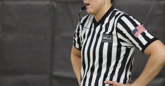 Hoquiam Middle School teacher Megan Pumphrey officiates a game at WIAA State Basketball Tournament in Yakima. Pumphrey was the only female referee present at the A-tournament level. Photo courtesy of Northwest Sports Photography