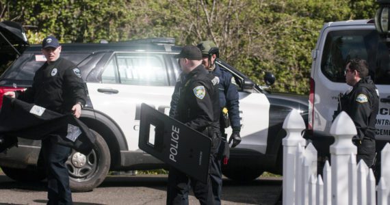After the 19-hour standoff between Hoquiam Police officers and an armed 15-year old suspect wanted on a felony warrant, officers were seen preparing to leave the scene. Matthew N. Wells | The Daily World