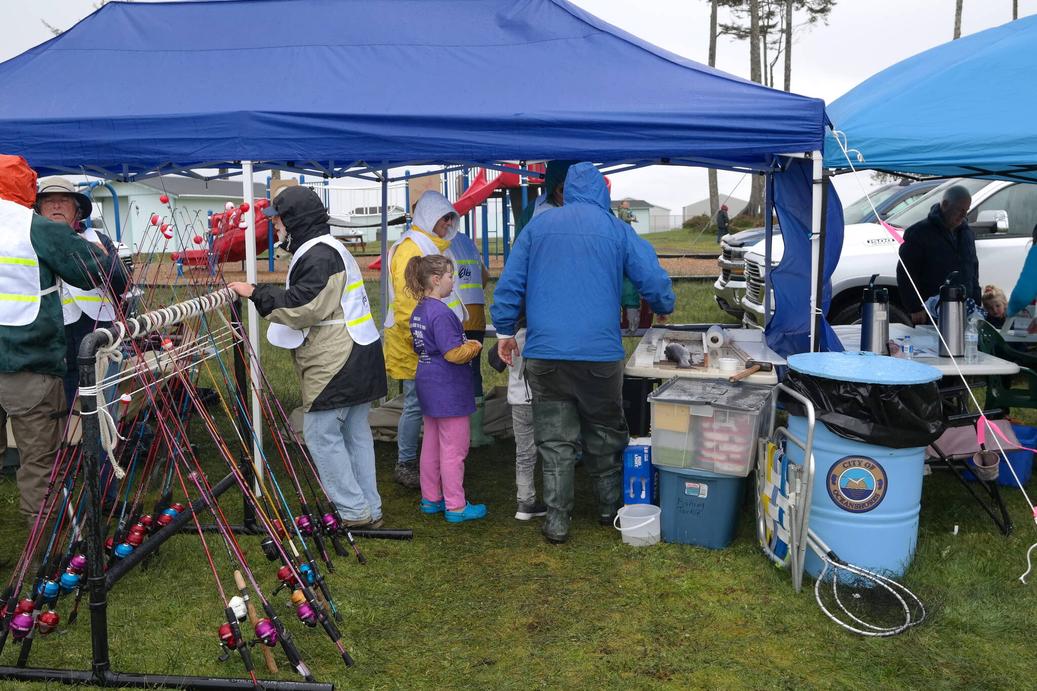 The Mark Swanson 12th Annual Ocean Shores Elks Youth Fishing Derby brought children and their families to Duck Lake on Saturday, May 7 despite poor weather conditions. Registration was free and participants were able to fish from a well-stocked lake while enjoying food, merchandise, and fish cleaning services. Erika Gebhardt I The Daily World