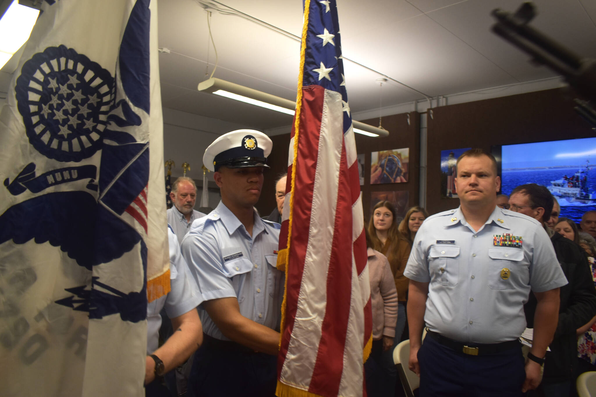 Matthew N. Wells | The Daily World
                                U.S. Coast Guard Seaman Ocasio Rodriguez, of the Coast Guard Honor Guard, carefully transports the U.S. Flag in front of Master Chief Shane Caroll, Command Master Chief for the Coast Guard’s 13th District, during a Colors presentation on Saturday, May 28, 2022, at the City of Westport’s Coast Guard City Designation Ceremony inside Westport Maritime Museum’s McCausland Hall.