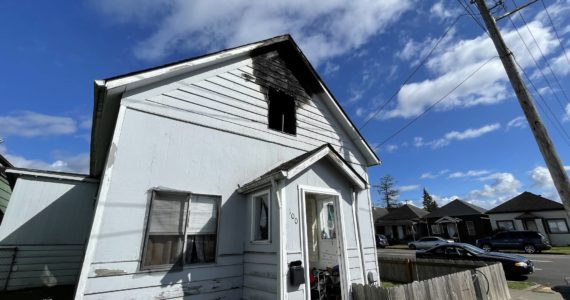 Damage is visible following a house fire on Thursday morning near the main Aberdeen fire station. (Michael S. Lockett | The Daily World)